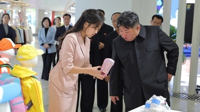 In this photo provided by the North Korean government, its leader Kim Jong Un, front right, and his daughter visit a garment and footwear exhibiion in Pyongyang, North Korea Monday, Oct. 19, 2026. Independent journalists were not given access to cover the event depicted in this image distributed by the North Korean government. The content of this image is as provided and cannot be independently verified. Korean language watermark on image as provided by source reads: "KCNA" which is the abbreviation for Korean Central News Agency. (Korean Central News Agency/Korea News Service via AP) (KCNA via KNS via AP) In this photo provided by the North Korean government, its leader Kim Jong Un, front right, and his daughter visit a garment and footwear exhibiion in Pyongyang, North Korea Monday, Oct. 19, 2026. Independent journalists were not given access to cover the event depicted in this image distributed by the North Korean government. The content of this image is as provided and cannot be independently verified. Korean language watermark on image as provided by source reads: "KCNA" which is the abbreviation for Korean Central News Agency. (Korean Central News Agency/Korea News Service via AP) (KCNA via KNS via AP)