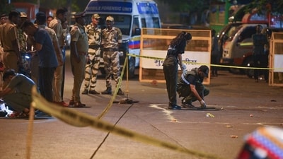 A forensic team collects samples from the spot where shots were fired at actor Tiger Shroff, in Mumbai on Sunday. (Photo for representation) (ANI )