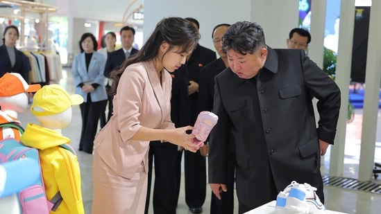 In this photo provided by the North Korean government, its leader Kim Jong Un, front right, and his daughter visit a garment and footwear exhibiion in Pyongyang, North Korea Monday, Oct. 19, 2026. Independent journalists were not given access to cover the event depicted in this image distributed by the North Korean government. The content of this image is as provided and cannot be independently verified. Korean language watermark on image as provided by source reads: "KCNA" which is the abbreviation for Korean Central News Agency. (Korean Central News Agency/Korea News Service via AP)