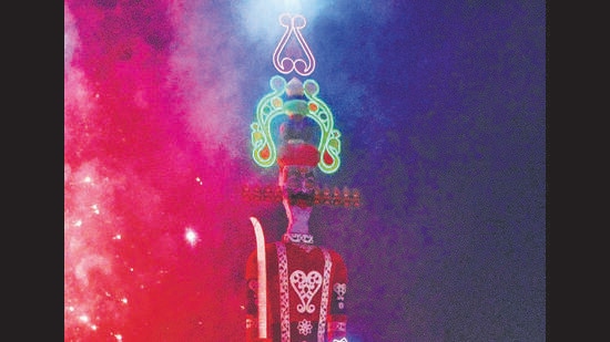 The region’s tallest Ravan set ablaze at Shalimar Grounds in Sector 5, Panchkula, on Tuesday evening. (Sant Arora /HT)