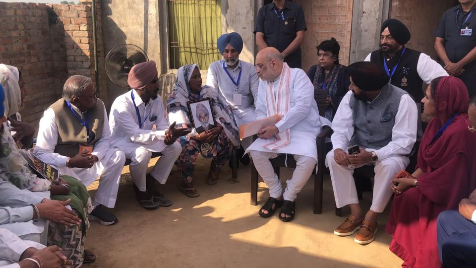 Amit Shah interacting with the family of a Dalit daily-wage worker who died on September 7 following casteist slurs after he questioned finance minister Harpal Cheema at a public event. (HT Photo) Amit Shah interacting with the family of a Dalit daily-wage worker who died on September 7 following casteist slurs after he questioned finance minister Harpal Cheema at a public event. (HT Photo)