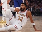 New York Knicks center Karl-Anthony Towns, below, argues a call during the first half of an NBA basketball game against the Philadelphia 76ers.