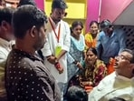 West Bengal Chief Minister Suvendu Adhikari interacts with the bereaved family of a Kolkata Chorbagan Durga Puja pandal stampede victim in Arambag, Hooghly, on Tuesday. 

