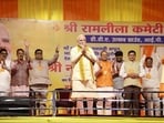 Prime Minister Narendra Modi greets during the Vijayadashami (Dussehra) celebrations at the DDA Utsav Ground, in New Delhi.