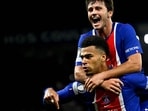 Desire Doue celebrates with Joao Neves after scoring his team's first goal vs Barcelona