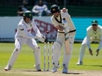 Australia's Steven Smith, centre is bowled out by South Africa's Wiaan Mulder, as South Africa's Ryan Rickelton, left, looks on day four of the second cricket test match between South Africa and Australia, in Gqeberha