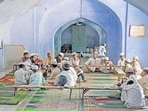 Students of a madrassa taking their lesson from their teacher (HT File Photo/Subrata Biswas)