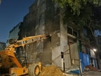 The cranes were deployed to support the building on Tuesday. (HT)