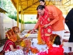 Uttarakhand chief minister Pushkar Singh Dhami performs havan and worships nine girls on the occasion of Maha Navami at his official residence.
