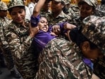 Security personnel detain a National Students’ Union of India (NSUI) worker during their protest against the Chief Election Commissioner, Gyanesh Kumar, demanding his resignation near the NSUI headquarters, in New Delhi.