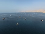 Ships recently anchored off Oman’s coast near the Strait of Hormuz. 