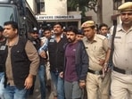 Gangster Lawrence Bishnoi is escorted by police personnel before being produced in Panchkula Court, Haryana, in 2019.