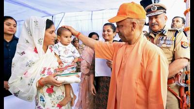 Chief minister Yogi Adityanath gives blessings to the child of a police officer, who laid down his life in the line of duty, during the ‘Remembrance Parade’ organised on the occasion of Police Commemoration Day-2026, in Lucknow on Wednesday. ((@myogiadityanath X/ANI Photo)) Chief minister Yogi Adityanath gives blessings to the child of a police officer, who laid down his life in the line of duty, during the ‘Remembrance Parade’ organised on the occasion of Police Commemoration Day-2026, in Lucknow on Wednesday. ((@myogiadityanath X/ANI Photo))