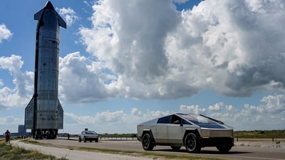 Tesla Cybertrucks lead the way as the SpaceX Starship spacecraft rolls out toward the launch pad before its 11th test flight from the company's complex in Starbase, Texas, US. (REUTERS)