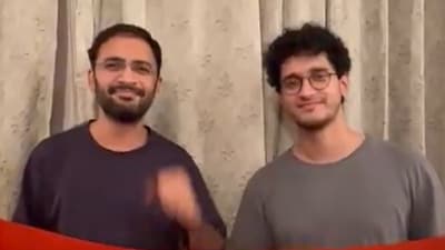 In the video, the duo is seen holding the Indian national flag and reiterating their demand for the resignation of Chief Election Commissioner Gyanesh Kumar. (X/Abhijeet Dipke) In the video, the duo is seen holding the Indian national flag and reiterating their demand for the resignation of Chief Election Commissioner Gyanesh Kumar. (X/Abhijeet Dipke)