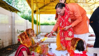 Uttarakhand chief minister Pushkar Singh Dhami performs havan and worships nine girls on the occasion of Maha Navami at his official residence. Uttarakhand chief minister Pushkar Singh Dhami performs havan and worships nine girls on the occasion of Maha Navami at his official residence.