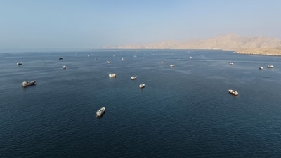 Ships recently anchored off Oman’s coast near the Strait of Hormuz. Ships recently anchored off Oman’s coast near the Strait of Hormuz.