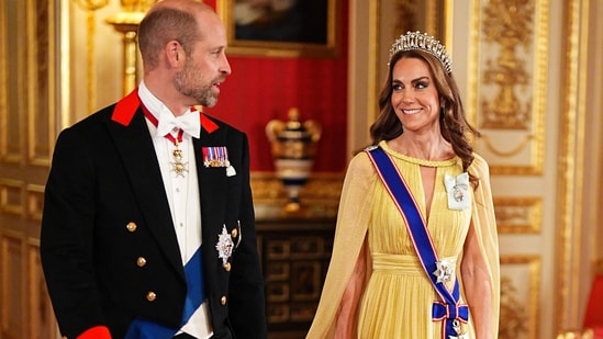Prince William, Prince of Wales and Britain's Catherine, Princess of Wales, arrive for a state banquet at Windsor Castle.