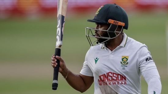 South Africa's Temba Bavuma acknowledges the crowd as he walks back to the pavilion following his dismissal on day three of the second Test match (AFP)