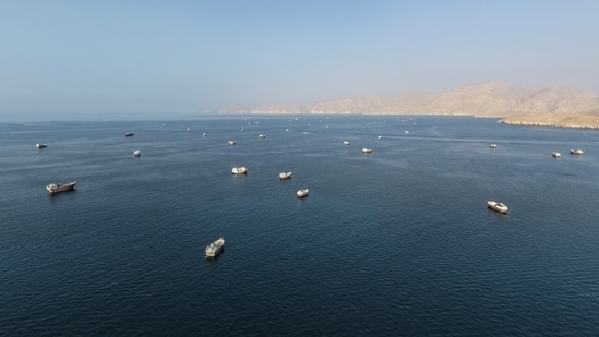 Ships recently anchored off Oman’s coast near the Strait of Hormuz. 