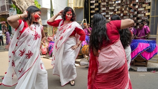 Women celebrate after 'Sindoor Khela' ritual on the occasion of 'Vijayadashami', the final day of the 'Durga Puja' festival, at a pandal, in Kolkata, West Bengal, Wednesday.
