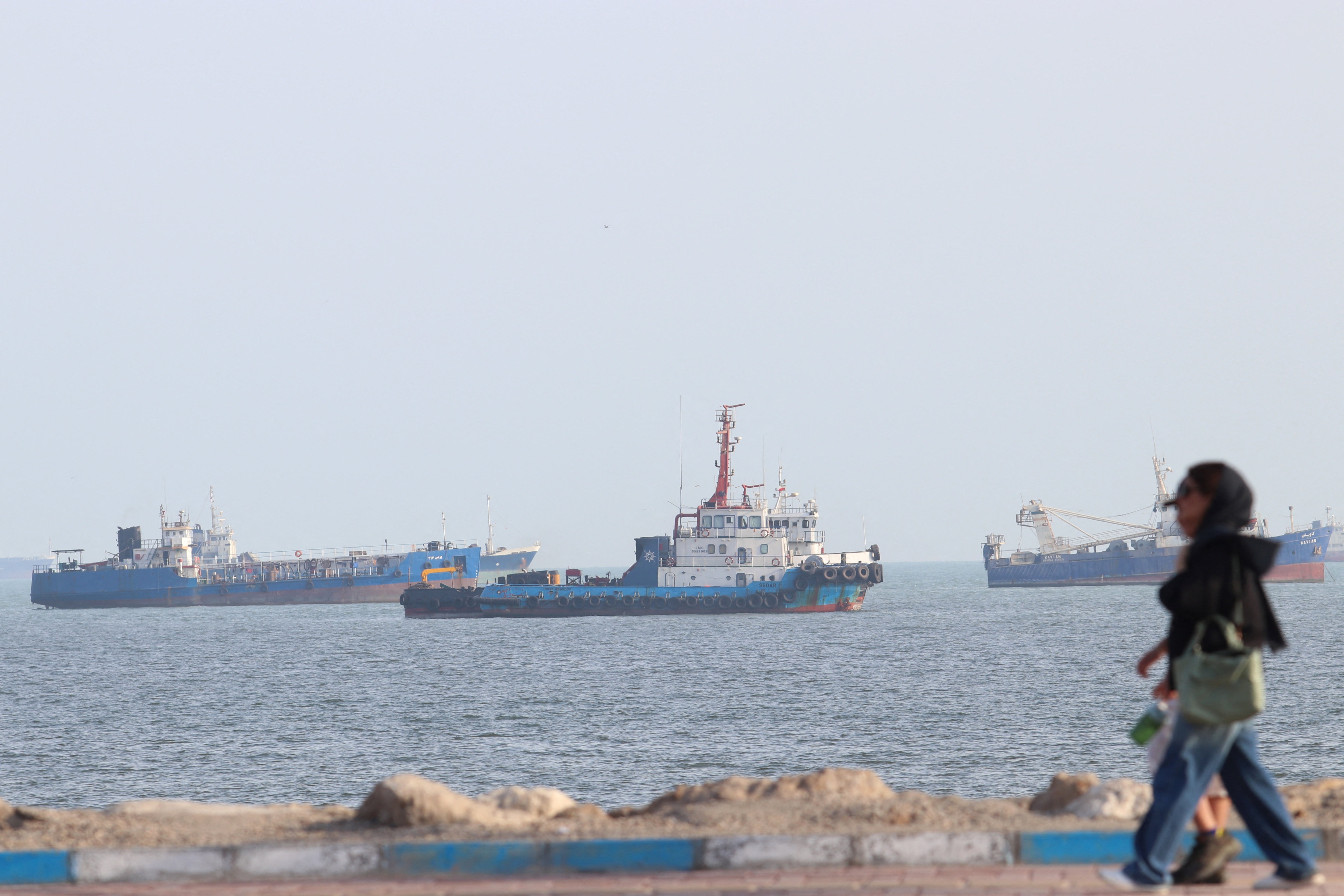 Vessels in the Strait of Hormuz near the beach of Bandar Abbas, Iran. (Wana via Reuters)