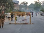 A security person stands near a barricade during a 48-hour statewide shutdown called by the Native People's Committee Manipur (NPCM) to protest the killing of three civilians and demand action against those responsible for the attack, at Lamlong in Imphal East.