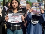 Medical interns hold placards as they conduct a strike over the government's failure to fulfil its commitment to increase their monthly stipend, at Government Medical College (GMC) in Srinagar, Jammu and Kashmir.