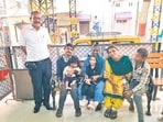Rajesh Pandey (left) with the family of a 4-year-old girl (in black, seated on her mother’s lap) who had gone missing from CSMT. Pandey tracked her down to a children’s home in Varanasi.