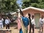 Rajnandgaon SP Ankita Sharma has been asked to explain her AK-47 firing during a Dussehra weapon-worship ceremony amid concerns over weapon-handling rules. (Video grab)