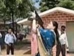 Rajnandgaon SP Ankita Sharma has been asked to explain her AK-47 firing during a Dussehra weapon-worship ceremony amid concerns over weapon-handling rules. (Video grab)