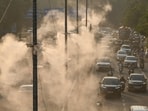 Sprinkler sprays water to settle dust on Vikas Marg near ITO as pollution levels rise in the Delhi-NCR region on Wednesday. (HT photo)