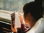 The science behind feeling dizzy and nauseous while reading a book in a moving car.(Unsplash)