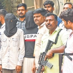 Three primary accused Actor Tiger Shroff firing case are escorted by the Mumbai Crime Branch's Anti-Extortion Cell after being produce in the Esplanade Court in Mumbai.