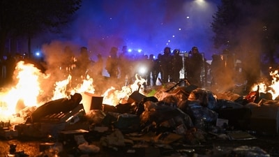 Multiple blazes gripped France as nationwide marches against soaring inflation degenerated into street violence of "extreme intensity". (Photo by Matthieu RONDEL / AFP) (AFP)