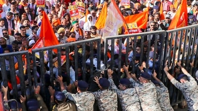 Police personnel attempt to evict National Dev Bhoomi Party workers during a protest demonstration outside the State Secretariat, in Shimla, Himachal Pradesh. (PTI Photo)