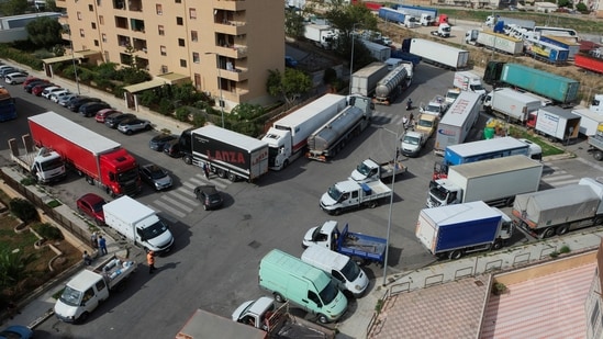 Trucks block streets in Palermo during a truckers' protest over soaring fuel and transport costs, disrupting supply chains across Sicily and southern Italy, October 20, 2026. 