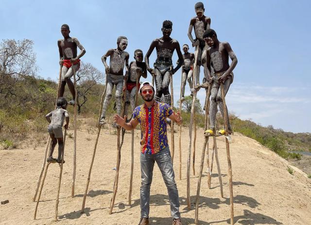Mohammad Anas, seen here with the Banna tribe, witnessed the Turning Of The Bones in Madagascar. (INSTAGRAM/@TravelWithAK) Mohammad Anas, seen here with the Banna tribe, witnessed the Turning Of The Bones in Madagascar. (INSTAGRAM/@TravelWithAK)