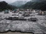 A drone view shows houses covered in mud after the flash floods and mudslide in Nepal on August 29, 2026. 