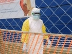 A healthcare worker walks through a treatment center for Ebola patients in Beni, North Kivu province, eastern Congo, Wednesday, Oct. 7, 2026. (AP Photo/Sebastien Kitsa Musayi)