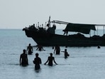 A fishing boat sails through the Suez Gulf towards the Red Sea. 