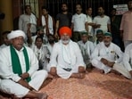 Bharatiya Kisan Union (BKU) leader Rakesh Tikait sits on a dharna in protest against the closure of gates at the Ganna Sansthan premises on the eve of his proposed 'Kisan-Mazdoor Mahapanchayat'