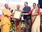 UP chief minister Yogi Adityanath and Union minister Jitendra Singh honouring state officials in Lucknow on October 23. (Sourced)