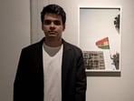 Artist and Photographer Raihan Vadra, son of Congress leader Priyanka Gandhi Vadra, with one of his photographs at Bikaner House. (PTI)