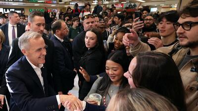 Canadian Prime Minister Mark Carney greets students during a visit to the University of Calgary, on October 15. (REUTERS) Canadian Prime Minister Mark Carney greets students during a visit to the University of Calgary, on October 15. (REUTERS)
