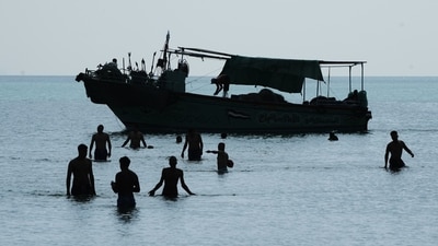 A fishing boat sails through the Suez Gulf towards the Red Sea. (AP File Photo)