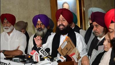 Leader of opposition Partap Singh Bajwa along with other Congress MLAs after walking out of the Punjab assembly on the second day of the session in Chandigarh on Friday. (Ravi Kumar/HT)