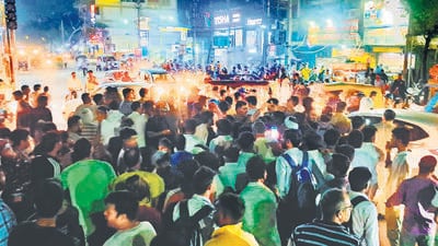 Locals blocked the railway station road on Friday to protest against the prolonged power cut. (HT Photo)