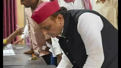 SP chief Akhilesh Yadav casts his vote for the UP Legislative Council (MLC) Graduate and Teacher constituency elections, at Saifai, in Etawah district, Friday. (PTI Photo) SP chief Akhilesh Yadav casts his vote for the UP Legislative Council (MLC) Graduate and Teacher constituency elections, at Saifai, in Etawah district, Friday. (PTI Photo)