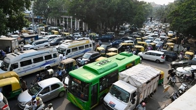 Traffic moves through Connaught Place as security was tightened. (Photo by Raj K Raj/ Hindustan Times)